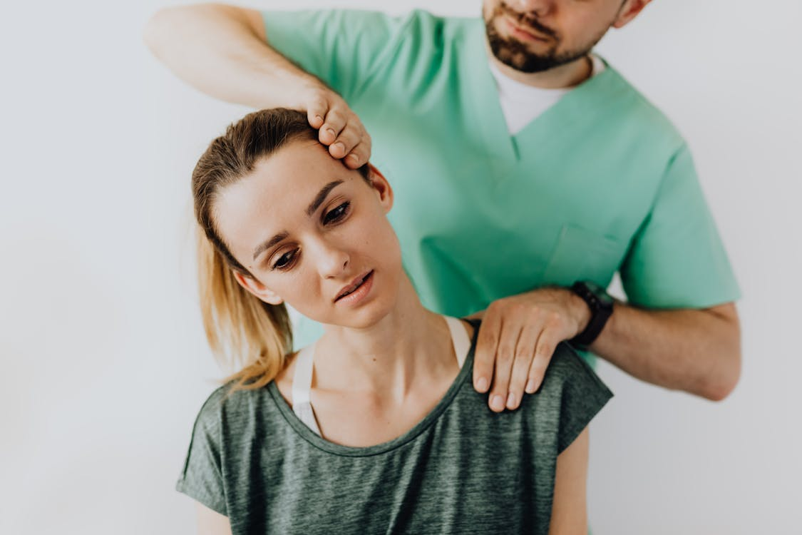 A chiropractic providing a service to a patient