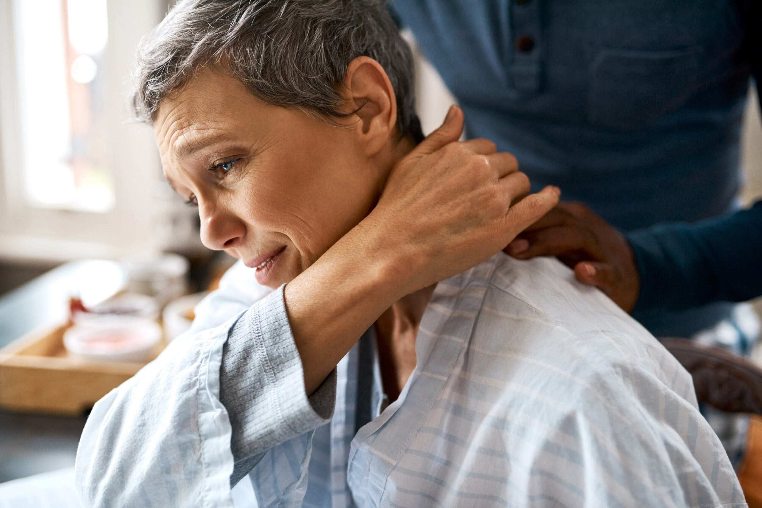 Always there for each other. Shot of an unrecognizable husband consoling his wife at home